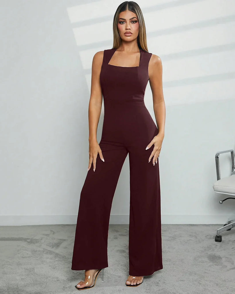 Model showcases a burgundy Square Neck Wide Leg Jumpsuit, featuring stylish wide legs and a flattering silhouette.