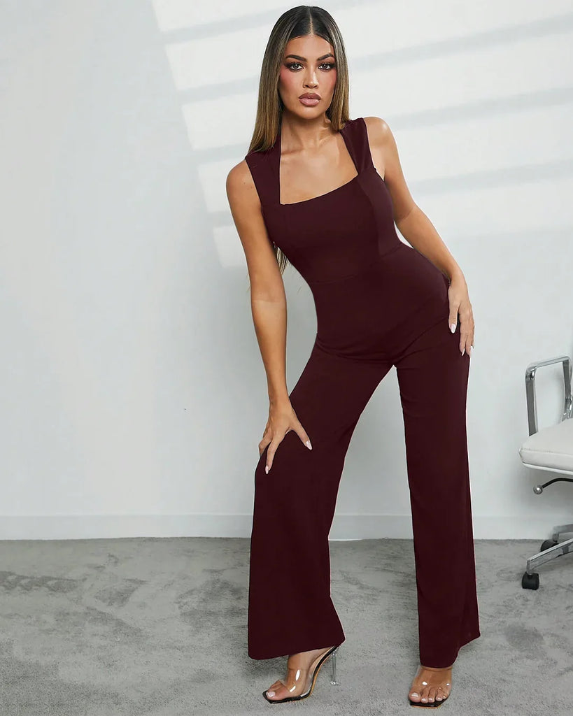 Model showcases a burgundy Square Neck Wide Leg Jumpsuit, featuring stylish wide legs and a flattering silhouette.