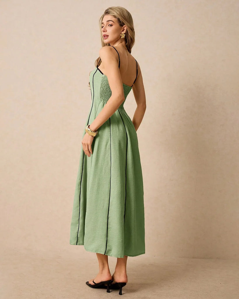 Light green midi dress featuring a strapless A-line pleated details.