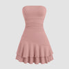 A rose-colored strapless mini dress featuring a fit-and-flare silhouette with layered hem detailing for a soft, sculpted look.