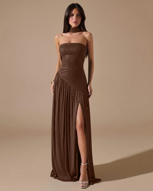 Women wearing Brown strapless fitted maxi dress with high slit and pleated skirt, featuring a sleek elegant silhouette