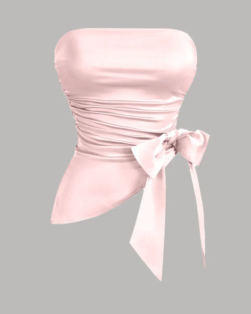 Front view of Cherry blossom satin crop top with strapless neckline, ruched hem and bow detail, featuring a slim fitted silhouette