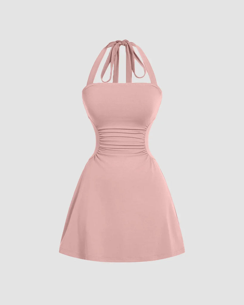 Pink halter mini dress with a tie around the neck, featuring a fit and flare design and strappy back.
