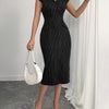 Front view of womens striped dress in black with lapel collar, button front and fitted midi silhouette for a sleek look.