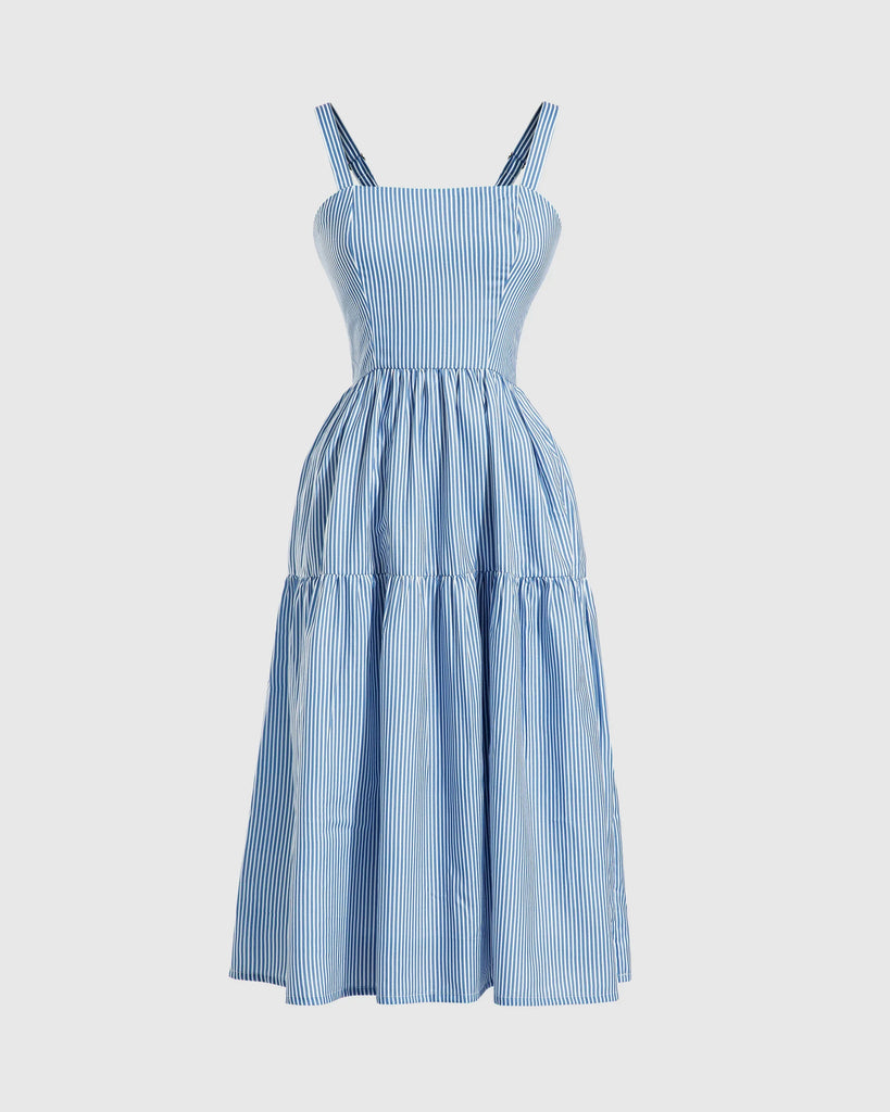 Blue striped dress featuring a smocked bodice and a bow tie detail at the neckline.
