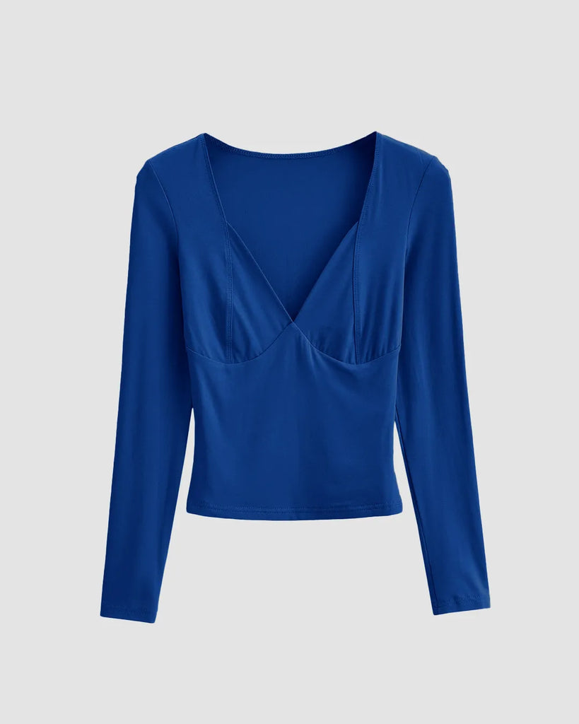 A stylish Surf Blue V-Neck Long Sleeve Top with a deep neckline, designed to enhance curves and add a pop of color.