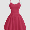 Hot pink sleeveless mini dress with a sweetheart neckline and a heart design on the front.