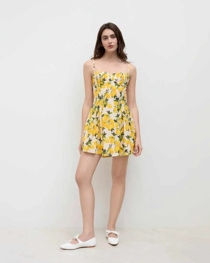 A-line dress featuring a sweetheart neckline with a vibrant lemon print design.
