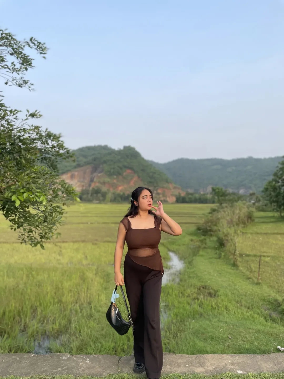 Customer photo 2 of Tie Front Asymmetrical Hem Sleeveless Top in Coco Brown