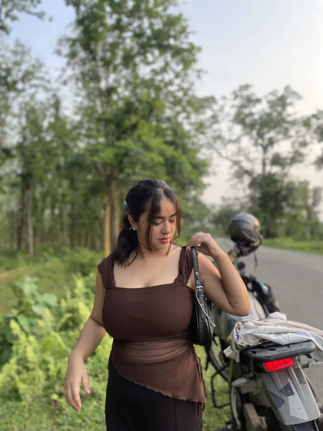 Customer photo 1 of Tie Front Asymmetrical Hem Sleeveless Top in Coco Brown