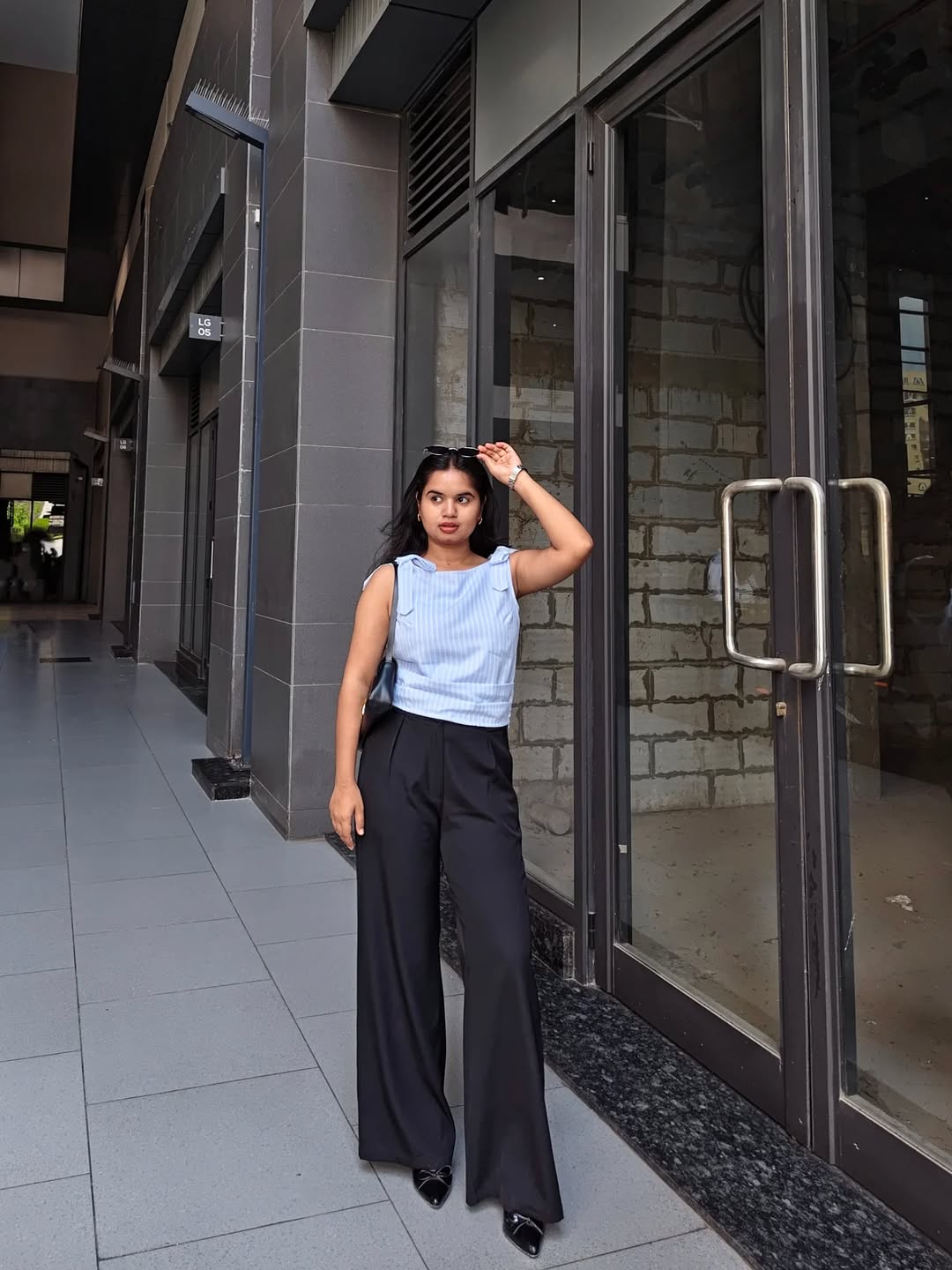 Customer photo 2 of Pleated High Waisted Wide Leg Trousers in Black