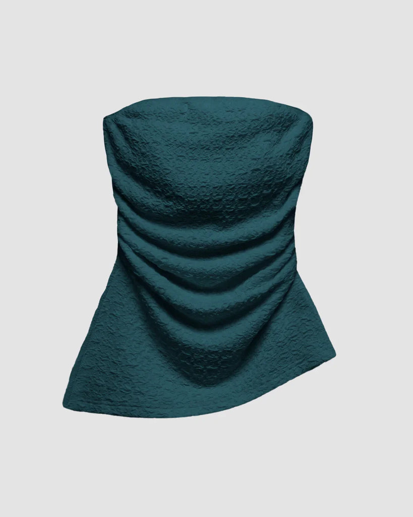 Stylish teal blue strapless ruched tube top featuring a textured finish and an eye-catching asymmetrical hemline