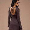 A sophisticated brown dress featuring a textured fabric, long sleeves, and a refined silhouette for an effortlessly elegant look.