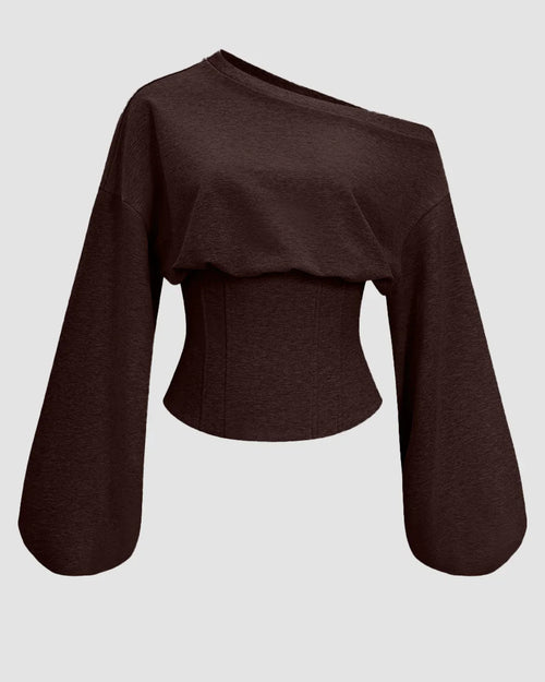 Front view of Chocolate brown corset-style top with an asymmetrical shoulder, tie-back detail, and fitted waist for a bold modern look.