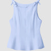 Powder blue fitted top featuring a stylish bow detail on the back.