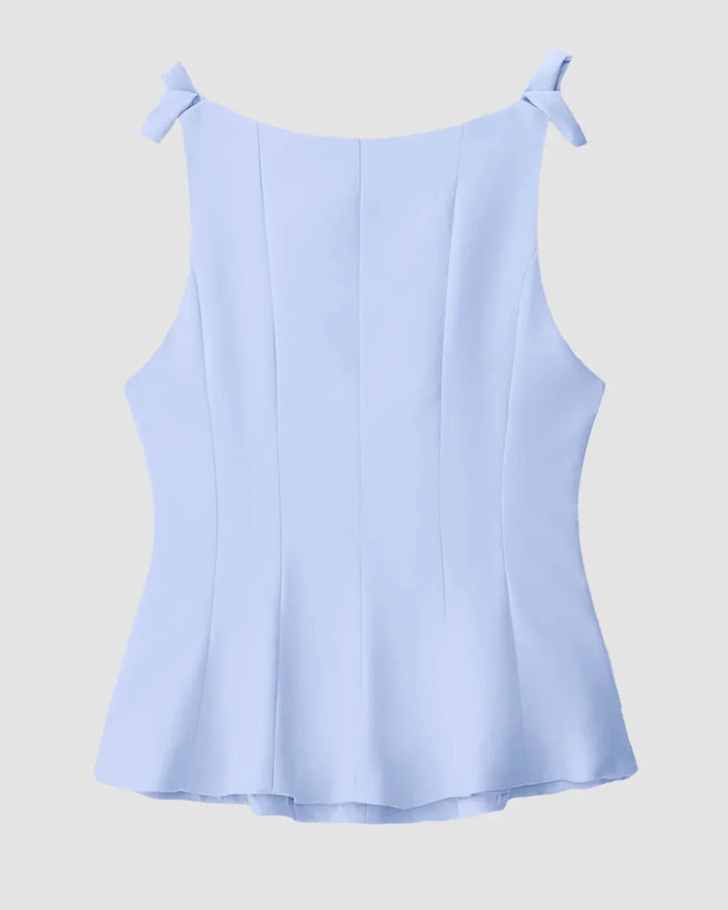 Back view of a Powder blue fitted top featuring a stylish bow detail on the back.
