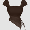 Front view of trendy sleeveless top in brown with square neckline, ruched side tie detail and asymmetric hem design