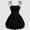 Front view of Black tie-shoulder cami mini dress with ruched bodice and layered skirt, shown front and back.

