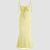 A vanilla-toned dress featuring tie straps and a ruched bust for a flattering fit.