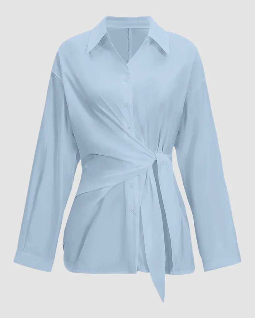 Women's sky blue button-down shirt with long sleeves and a tie around the waist.