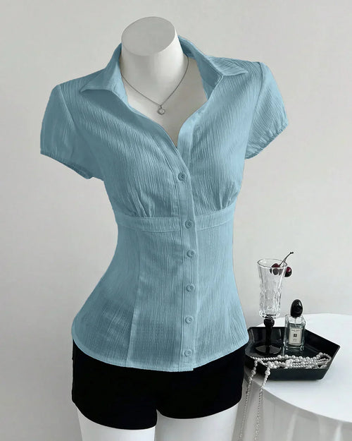Front view of Sky blue shirt for women with V-neck collar and waist-cinched fit, textured fabric and short sleeves
