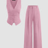 A dark pink suit featuring a V-neck button vest and mid-rise wide-leg trousers.