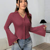 Woman wearing a Maroon knit top with collared neckline, button-down front and flared long sleeves offering a soft textured casual look