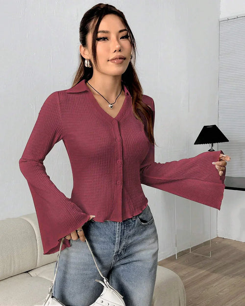 Woman wearing a Maroon knit top with collared neckline, button-down front and flared long sleeves offering a soft textured casual look