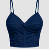Front view of v neck crop top in navy blue with twist front and ruched detailing, featuring thin straps and a fitted flattering silhouette