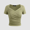 Front view of Sage green ribbed V-neck wrap top with short sleeves and a cinched waist, offering a flattering fit and soft structure