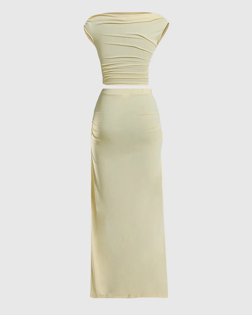 Back view of a vanilla ruched sleeveless bodycon maxi dress made of yellow fabric, showcasing a fitted silhouette and elegant design.
