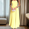 A vanilla yellow strapless fit and flare midi dress with a flared skirt, perfect for adding a touch of sunshine to any occasion.