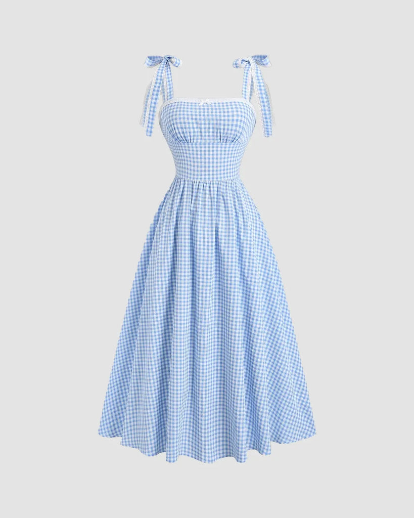 Blue checkered midi dress with a vintage-inspired silhouette, exuding timeless charm.