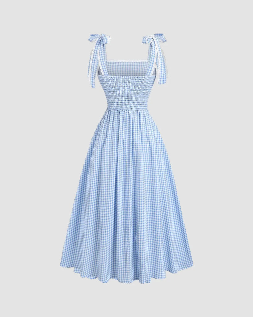Back view of a Blue checkered midi dress with a vintage-inspired silhouette, exuding timeless charm.