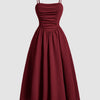 Vintage retro burgundy dress with a ruched neckline and spaghetti straps, showcasing a classic and elegant style