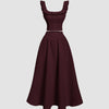 Vintage sleeveless maroon dress made of cotton, featuring a top and skirt set in a classic style.