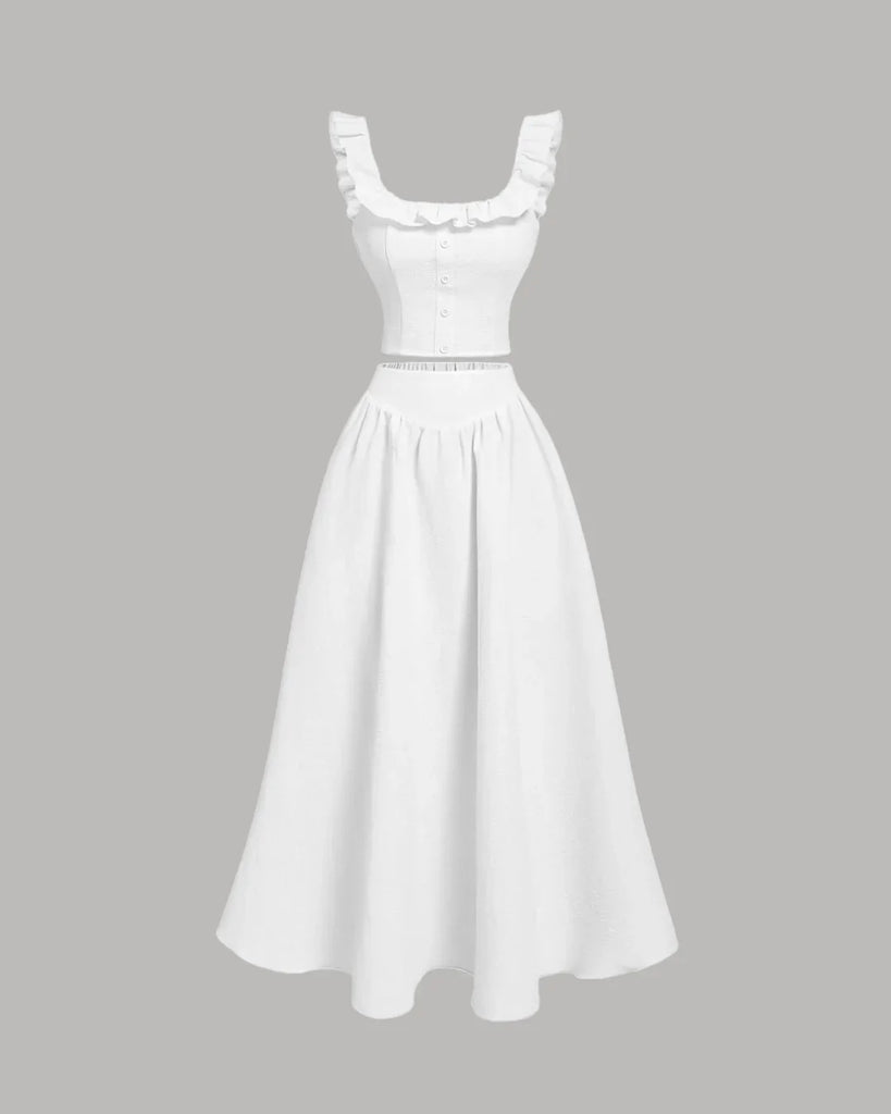Vintage off-white dress with ruffled shoulders, featuring a sleeveless top and matching skirt set.