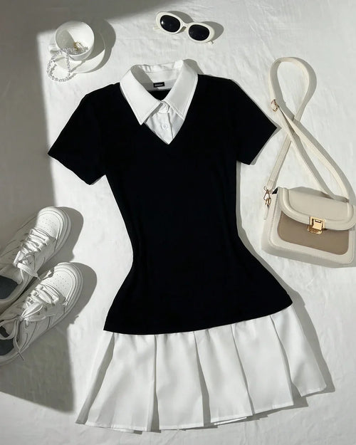 Front view of A black collared top paired with a white pleated skirt, styled in a flat lay with sneakers, sunglasses, and a shoulder bag.
