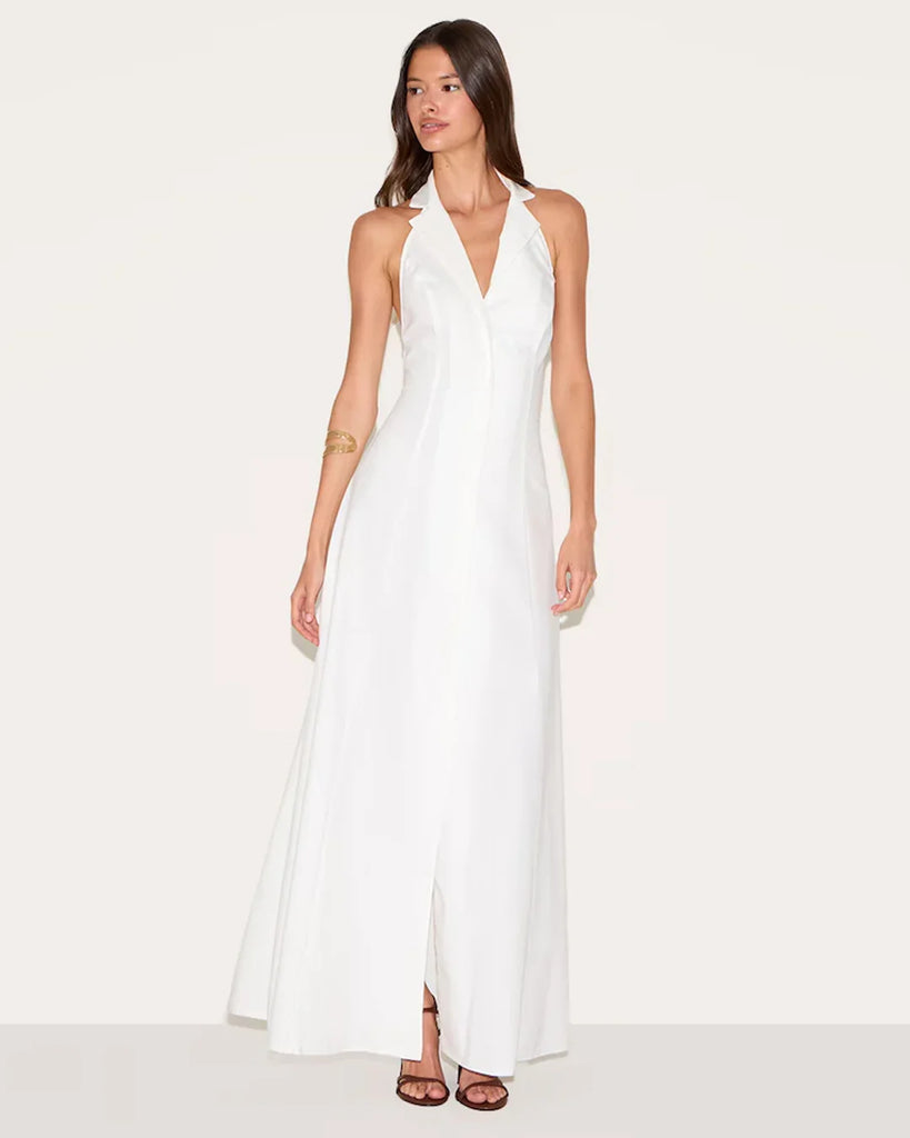 White halter neck maxi dress featuring a deep neckline and a front slit, elegant and stylish for formal occasions.