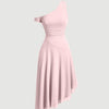 A light pink dress featuring an asymmetric neckline and short sleeves, embodying the bold, playful essence of Y2K fashion.