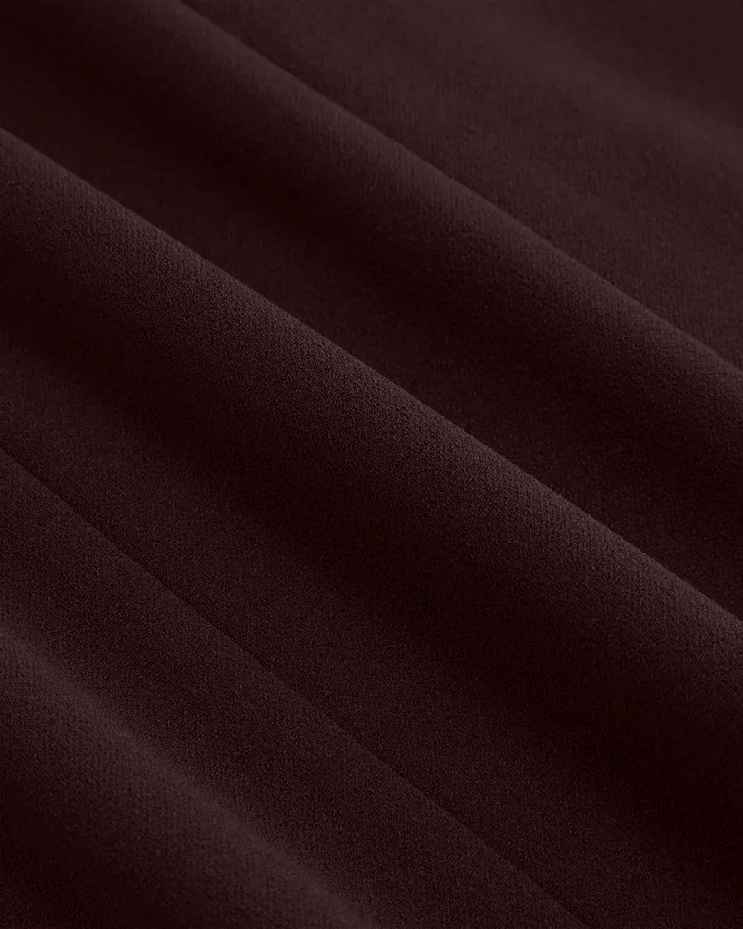 Closed view of Dark brown sleeveless A-line mini dress with a zip front, named Chocolate Fondae.