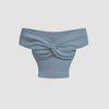 Dusty blue off-shoulder ribbed knit crop top with a twist-front detail for a soft, sculpted look.