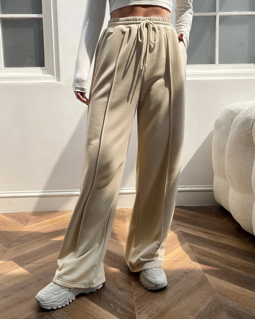 A woman wearing Front Slant Pocket Drawstring Stylish Trouser in Cosmic Latte Tone