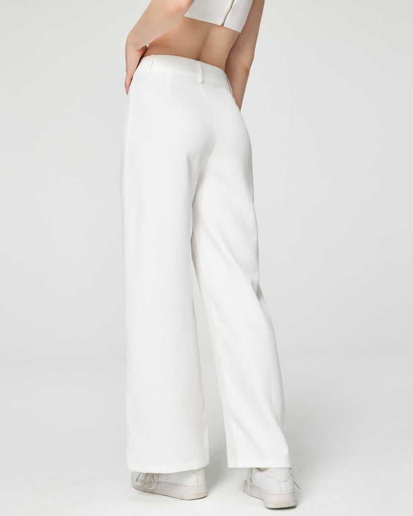 Model wearing a wide leg trouser in white