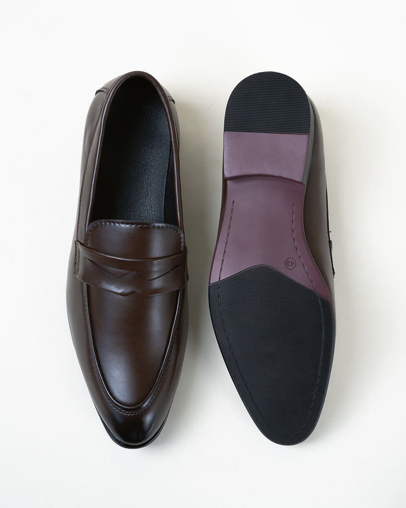 A  pair of woody brown loafers 
