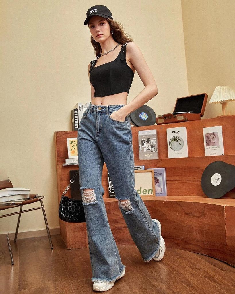 women wearing stylish black sleeveless top featuring straps and corset-style buckle details