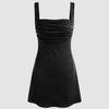Black mini dress with a ruched square neckline and wide shoulder straps