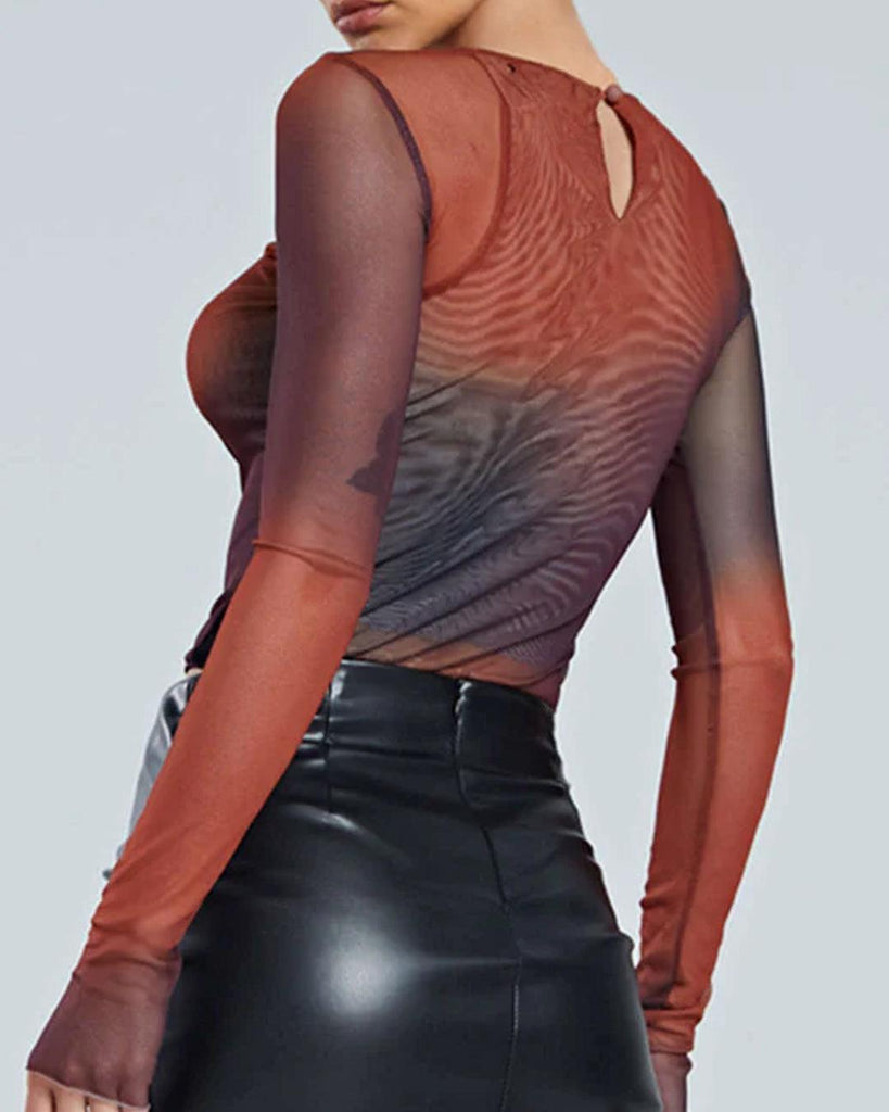 Tie-dye cropped top with long sleeves and a sheer mesh back, showcasing a stylish and modern design side view