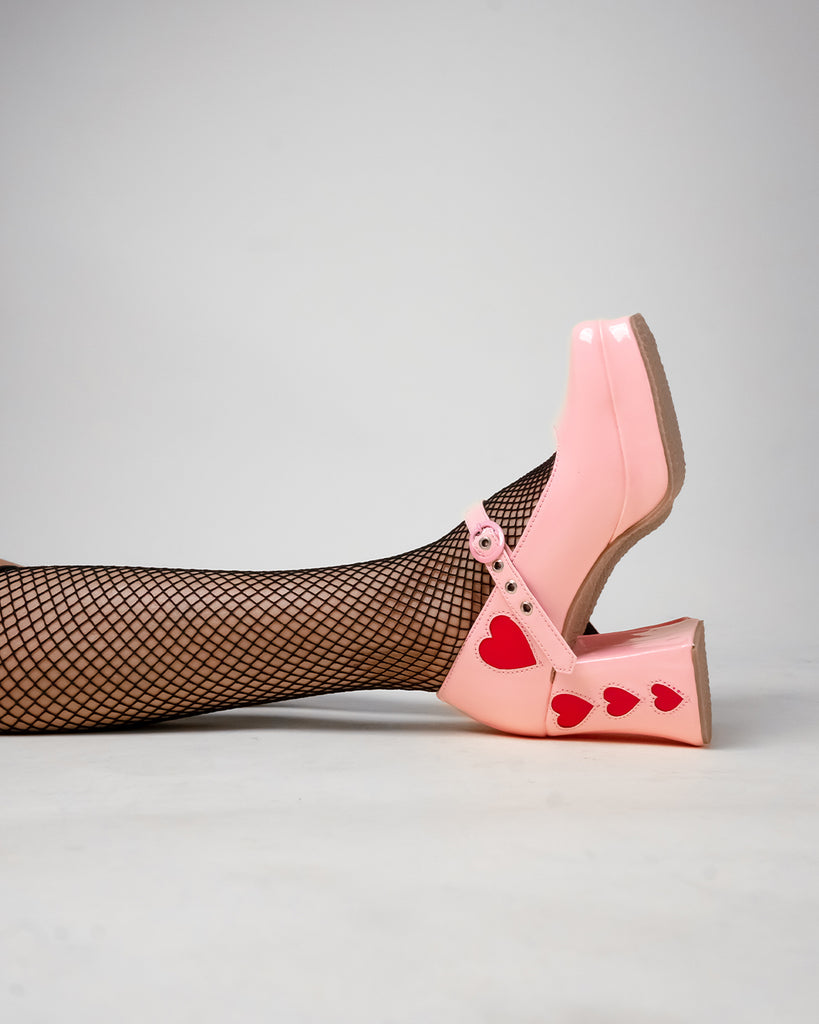 A pair of pink color platform heels